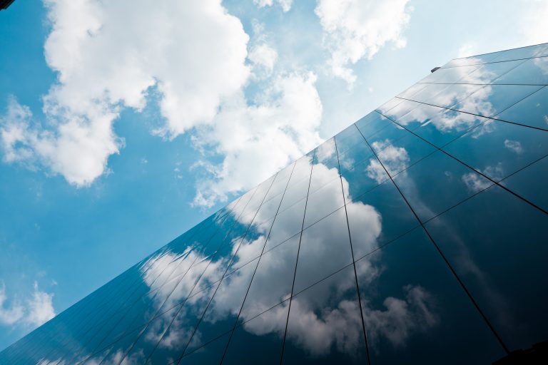 Business-Building-with-Clouds-GettyImages-184316397-768×512